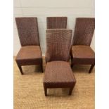 Four rattan dining chairs