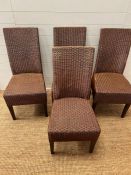 Four rattan dining chairs