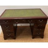 A mahogany pedestal desk with green leather top (H77cm W120cm D61cm)