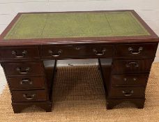 A mahogany pedestal desk with green leather top (H77cm W120cm D61cm)