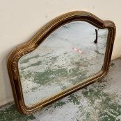 A shaped mirror with floral corners