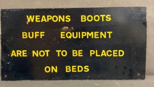 A vintage military sign