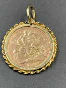 An 1897 Victorian half sovereign in a hallmarked 9ct gold pendant mount combined weight