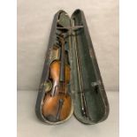 An antique violin in case (Missing strings) along with a violin bow marked Dodd for John Dodd of