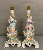 Two fine porcelain table lamps of a lady and a gentleman in a regency floral style in the manner