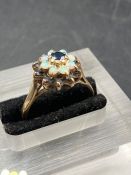 A 9ct garnet and opal ring (Approximate Total Weight 3.4g) AF