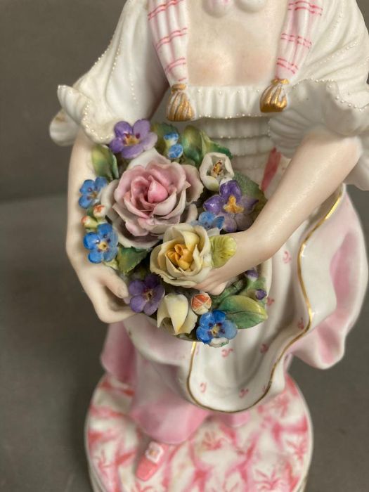 An 19th Century Bisque figure of a lady holding flowers - Image 5 of 5