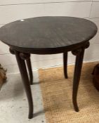 A circular side table on out sprayed legs and ball details to sides (H55cm Dia48cm)