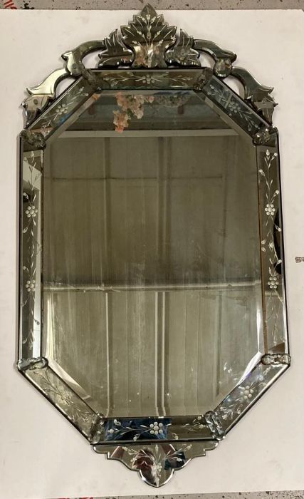 A late 19th century venetian etched glass wall mirror, pierced cresting above bevelled octagonal