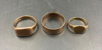 Three 9ct gold rings, two signet style one wedding band. Approximate Total weight 13.6g Sizes X, V &