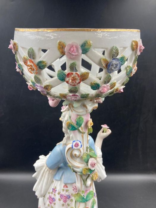 An 19th Century porcelain figural centrepiece depicting woman carrying flowers - Image 3 of 5