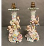 A pair of 19th Century porcelain candlesticks by Sitzendorf converted to lamp bases