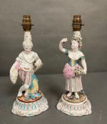 A pair of 19th Century porcelain figures converted to lamp bases