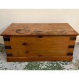 A pine chest with metal bounding (H43cm W92cm D46cm)