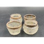 Two pairs of hallmarked silver rimmed cut glass salts.