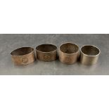 A selection of four silver napkin rings, various hallmarks and makers. (Approximate Total Weight