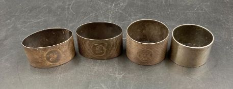 A selection of four silver napkin rings, various hallmarks and makers. (Approximate Total Weight
