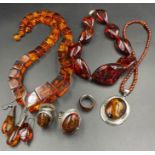 A large selection of quality Baltic amber jewellery to include three necklaces and three silver