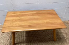 An Ercol Mid Century coffee table with shelf under (H38cm W99cm D68cm)