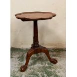 A mahogany wine table on claw and ball feet with a scalloped edge top (H57cm Dia40cm)