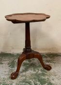 A mahogany wine table on claw and ball feet with a scalloped edge top (H57cm Dia40cm)