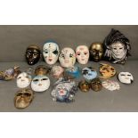 A selection of wall hanging Venetian style masks