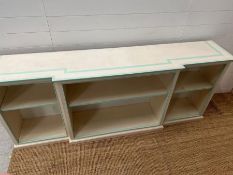 A breakfront low bookcase with adjustable shelves to each section (H83cm W206cm D41cm)