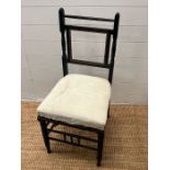 An ebonised single chair