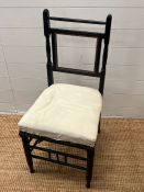 An ebonised single chair