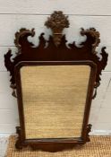 An Italian style carved wood mirror