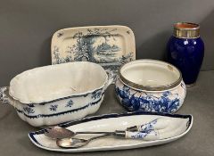 A selection of blue and white china to include salad servers, white meal rimmed pots etc