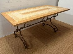 A faux marble top dining table with scrolling metal frame in the tyle of Gilbert Poillerat (H78cm