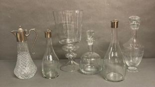 A selection of quality glassware to include four a decanters, a claret jug and large vase.
