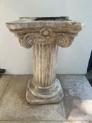 A fluted stone plinth with fluted and scrolling corners (H73cm)