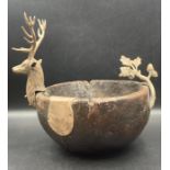 An antique oak and white metal bowl with stags head and white metal panel