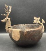 An antique oak and white metal bowl with stags head and white metal panel