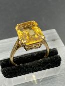 A vintage single stone citrine ring, emerald cut citrine weighing an estimated 6.70ct claw set