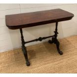 A mahogany side table on barley twist supports ending in splayed carved and scrolling feet (H69cm