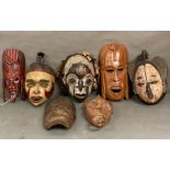 A selection of wall hanging tribal masks