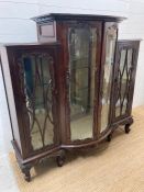 A mahogany three cupboard bow fronted display cabinet with ornate carved glazed doors (H135cm Q140cm