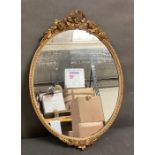 A gilt framed Rococo style hall mirror 48cm x 34cm