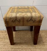 A Mid Century upholstered foot stool