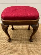 A George II style stool with cabriole legs and upholstered seat