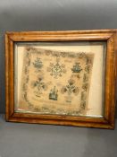 An antique sampler, framed