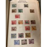 A pre decimal world stamp album including some Great Britain, Penny Reds etc