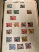 A pre decimal world stamp album including some Great Britain, Penny Reds etc