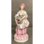 An 19th Century Bisque figure of a lady holding flowers