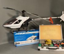 A vintage Kyosho concept radio controlled helicopter with cased Macgregor power panel and JR propo
