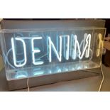 A neon "Denim" sign