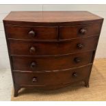 A bow front two over three mahogany chest of drawers (H104cm W104cm D52cm)
